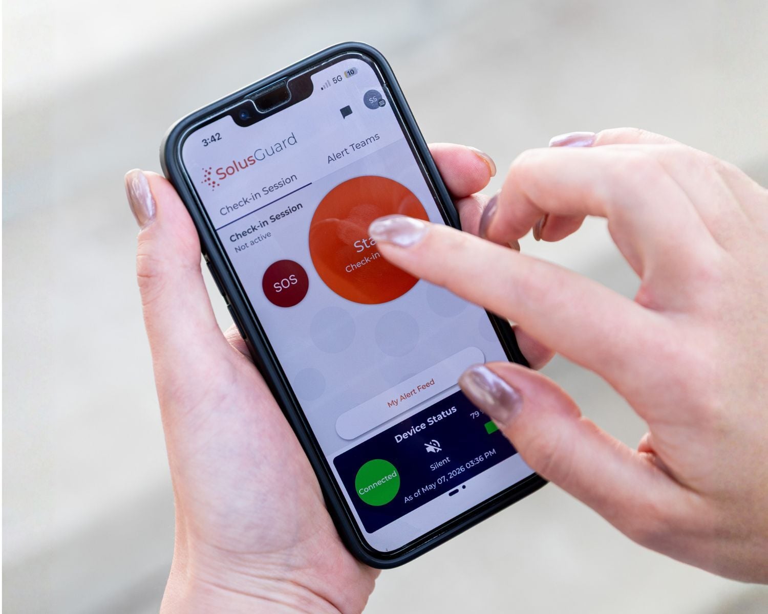 The SolusGuard mobile app on a phone, ready to start a check-in
